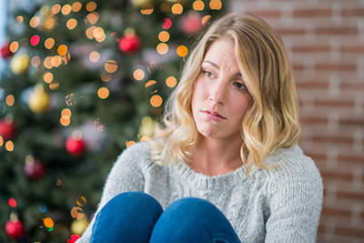woman experiencing holiday depression