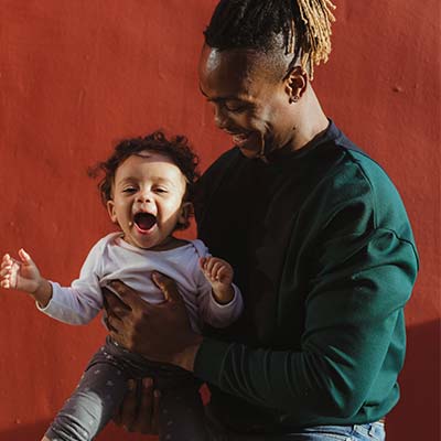 Father and baby playing